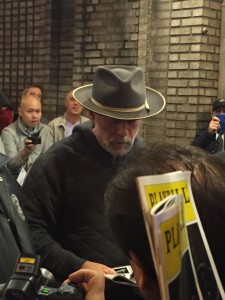 Bruce Willis signing playbills.